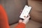 Das Bild zeigt eine Hand mit Smartphone und geöffneter ViCare App als Symbol für die Vitoair CT Steuerung per App 